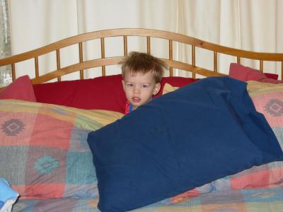 My Nephew hiding in the covers.